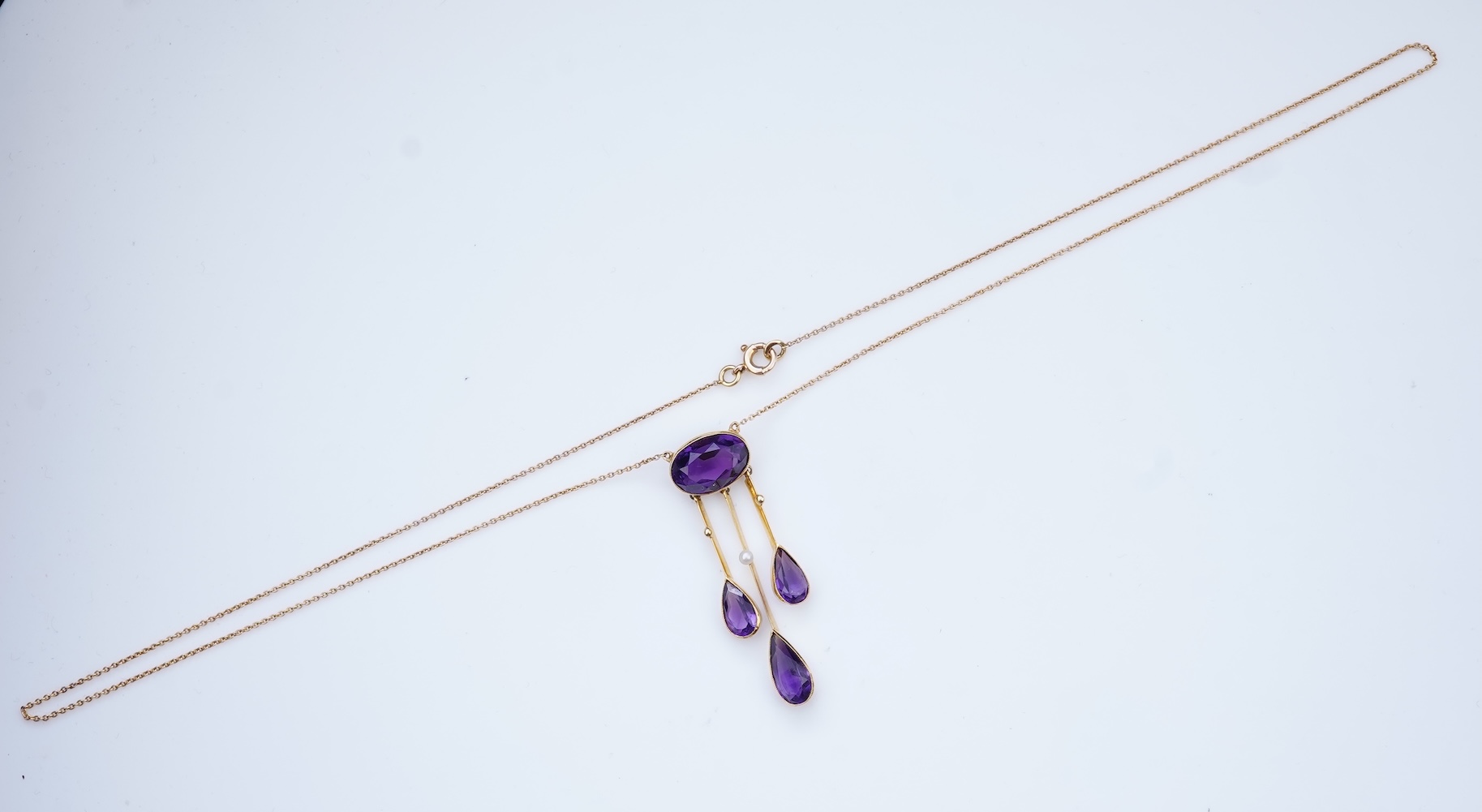 An Edwardian amethyst and seed pearl pendant, circa 1910